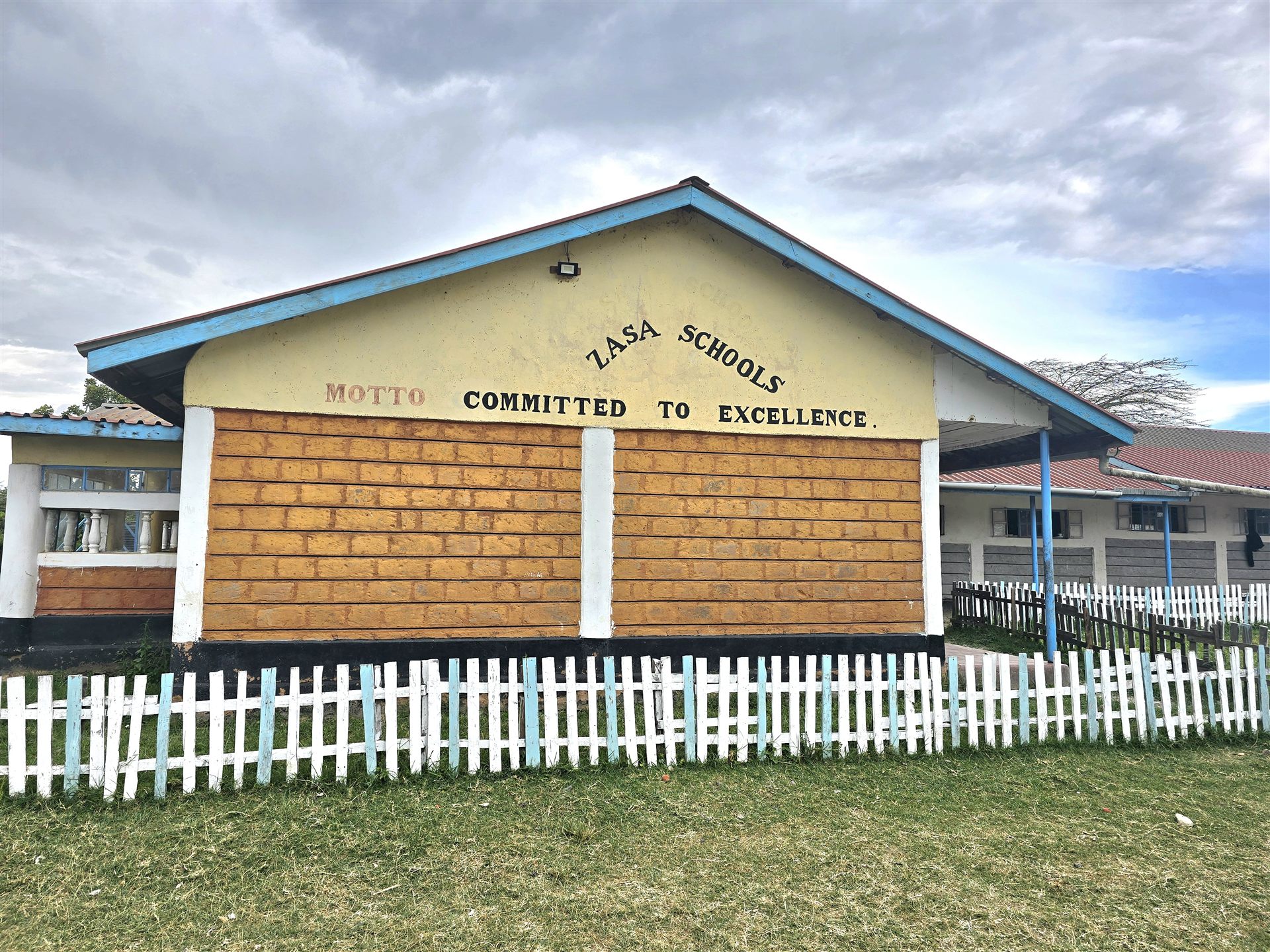 Zasa Schools classroom block in Chepalungu, with the motto Committed to Excellence painted on the gable